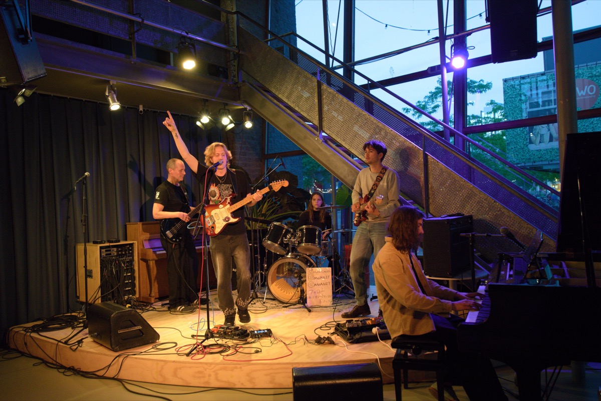 Moanzy leading a full-band jam on stage