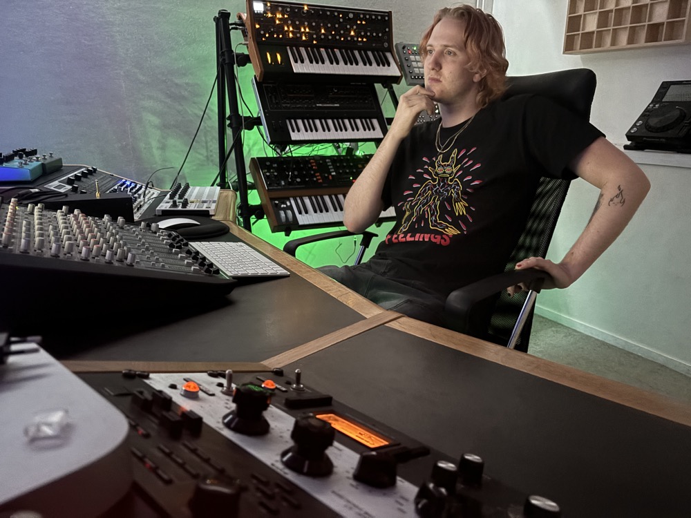 Moanzy at his home studio, surrounded by synths